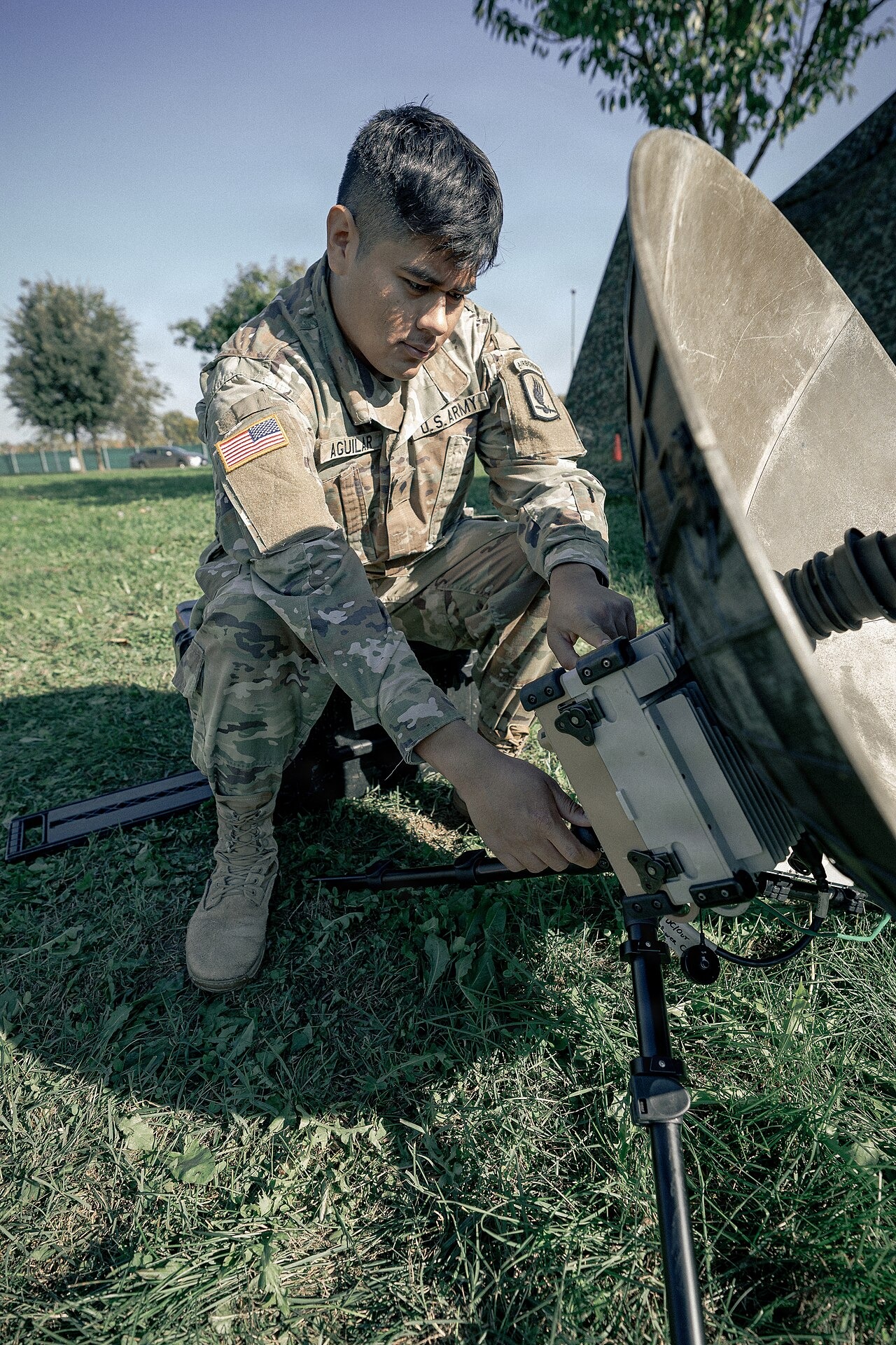 File photo: A U.S. Army communications specialist configures a satellite communications terminal during a military communications training exercise in Italy. Illustrative context; not a photograph of the reported event.