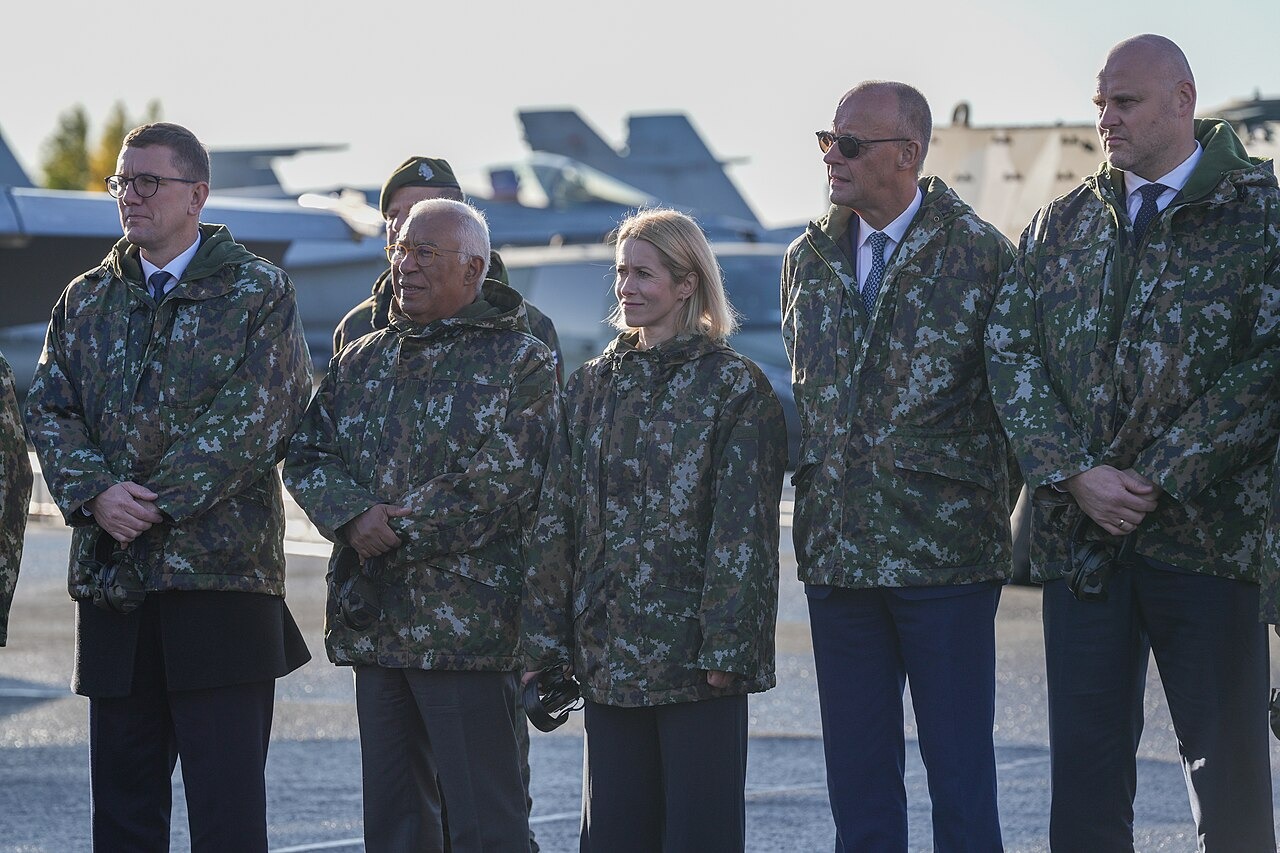 File photo: Officials stand during a visit to the Lapland Air Wing, with military aircraft visible behind them. Illustrative context; not a photograph of the reported event.